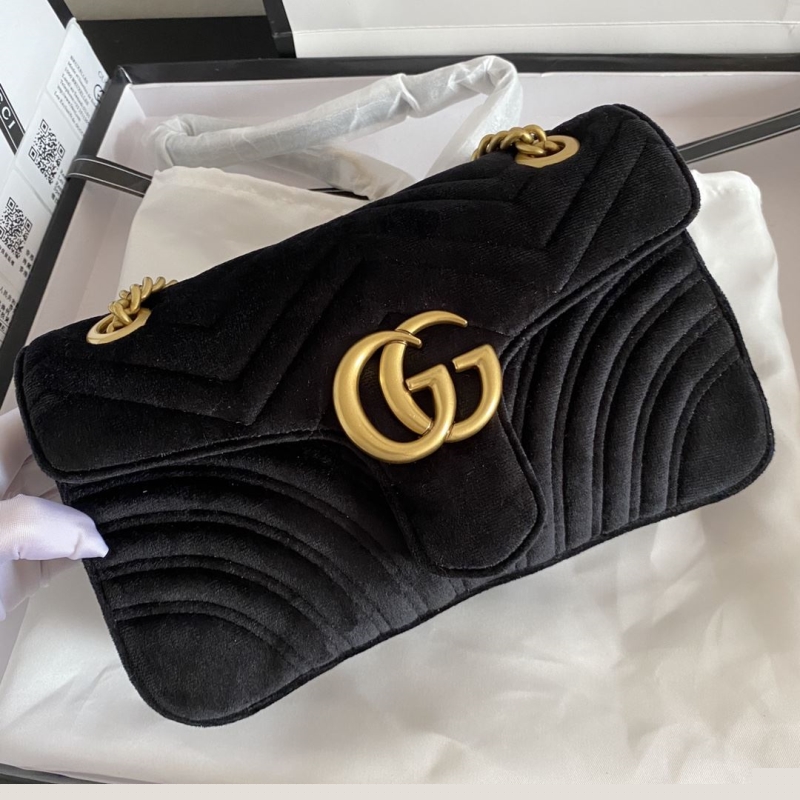 G*u*i clutch bags